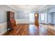 Elegant dining room with hardwood floors, chandelier, and classic moldings at 515 Roland Manor Dr, Dacula, GA 30019