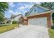 Exterior view of two-story home with brick and siding at 515 Roland Manor Dr, Dacula, GA 30019