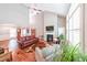 Spacious living room with high ceilings, hardwood floors, fireplace, and lots of natural light at 515 Roland Manor Dr, Dacula, GA 30019