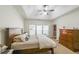 Relaxing main bedroom with lots of natural light, tray ceilings, and neutral decor at 515 Roland Manor Dr, Dacula, GA 30019