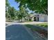 Residential street view showcasing the traditional brick and siding homes and landscaping at 515 Roland Manor Dr, Dacula, GA 30019