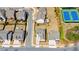 Aerial neighborhood view featuring tennis courts and manicured residential streets at 6210 Bellmoore Park Ln, Duluth, GA 30097