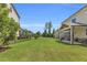 Expansive, well-manicured backyard with a covered patio, ideal for outdoor activities at 6210 Bellmoore Park Ln, Duluth, GA 30097