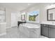Bright bathroom featuring a marble tub, separate shower, and double vanity sinks at 6210 Bellmoore Park Ln, Duluth, GA 30097