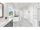 Bright bathroom featuring a marble tub, separate shower, and double vanity sinks at 6210 Bellmoore Park Ln, Duluth, GA 30097