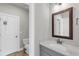 Bathroom featuring a vanity with a white countertop and a wood framed mirror at 6210 Bellmoore Park Ln, Duluth, GA 30097