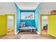 Cozy nook with bright accent walls and an adjacent play area with yellow doors at 6210 Bellmoore Park Ln, Duluth, GA 30097