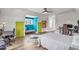 Bright bedroom featuring wood floors and colorful accent walls, complete with a desk and adjacent sitting nook at 6210 Bellmoore Park Ln, Duluth, GA 30097
