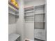 A small closet with built-in shelving and drawers with great storage for clothes and accessories at 6210 Bellmoore Park Ln, Duluth, GA 30097