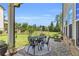 Charming covered patio with outdoor dining set, creating an inviting space for gatherings at 6210 Bellmoore Park Ln, Duluth, GA 30097