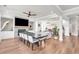 Open-concept living room with hardwood floors, recessed lighting, and a stone fireplace at 6210 Bellmoore Park Ln, Duluth, GA 30097