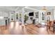 A spacious living room features hardwood floors, ample natural light, and an open floor plan at 6210 Bellmoore Park Ln, Duluth, GA 30097