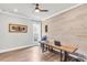 Office space with wood paneled accent wall, contemporary desk, and natural light at 6210 Bellmoore Park Ln, Duluth, GA 30097