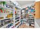 Walk-in pantry features many shelves and storage space for food and small appliances at 6210 Bellmoore Park Ln, Duluth, GA 30097