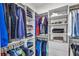 Walk-in closet with built-in shelving and ample storage for clothes and accessories at 6210 Bellmoore Park Ln, Duluth, GA 30097