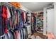 Walk-in closet with built-in shelving and ample storage for clothes and accessories at 6210 Bellmoore Park Ln, Duluth, GA 30097