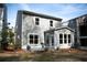 Backyard featuring a stone patio, green lawn, and privacy landscaping at 1098 Central Park Rd, Decatur, GA 30033