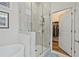 This bathroom features a glass shower and a doorway into a walk-in closet at 1098 Central Park Rd, Decatur, GA 30033
