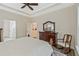 This bedroom includes wood floors, an area rug, a ceiling fan, a window, and a rocking chair at 1098 Central Park Rd, Decatur, GA 30033