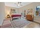 Bright bedroom featuring a ceiling fan, bed, bench, and french doors to the outside at 1098 Central Park Rd, Decatur, GA 30033
