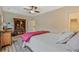 Bedroom showcases a bookshelf, ceiling fan, and neutral color palette for a relaxing ambiance at 1098 Central Park Rd, Decatur, GA 30033