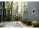 View of the side of a well-maintained condo with beautiful trees and manicured landscaping at 1098 Central Park Rd, Decatur, GA 30033