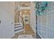 Bright foyer features hardwood floors, wainscotting, staircase, and an open view to the second floor at 1098 Central Park Rd, Decatur, GA 30033
