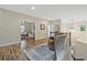 Wood floors at the top of the stairs lead to the living room and other areas of the house at 1098 Central Park Rd, Decatur, GA 30033