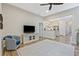 Living room with hardwood floors opens to a kitchen with stainless appliances at 1098 Central Park Rd, Decatur, GA 30033