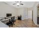 Office area with neutral walls and wood-look floors, illuminated by a ceiling fan at 1098 Central Park Rd, Decatur, GA 30033