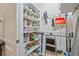 Walk-in pantry with shelving holding supplies and cleaning accessories at 1098 Central Park Rd, Decatur, GA 30033