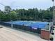 Aerial view of community tennis courts surrounded by lush trees, perfect for outdoor sports at 1098 Central Park Rd, Decatur, GA 30033
