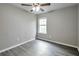 Cozy bedroom with sleek flooring, neutral color palette, and a fan for added comfort at 2463 Corner Shoals Dr, Decatur, GA 30034
