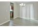 Dining area adjacent to kitchen, showcasing modern lighting and sliding glass doors for natural light at 2463 Corner Shoals Dr, Decatur, GA 30034