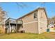 View of the back exterior of the home with deck at 2463 Corner Shoals Dr, Decatur, GA 30034