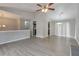 Open-concept space with updated lighting and vaulted ceilings, seamlessly blending dining and living at 2463 Corner Shoals Dr, Decatur, GA 30034