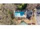 Overhead view featuring a community pool, surrounding trees, and parking area at 4249 Millside Walk, Smyrna, GA 30080