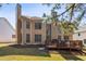Backyard view of two-story home featuring a deck with a sunburst design at 4249 Millside Walk, Smyrna, GA 30080
