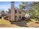 Backyard view of home featuring a large deck and wooded area at 4249 Millside Walk, Smyrna, GA 30080