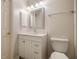 Bright bathroom featuring a vanity with a white countertop, framed mirror, and modern fixtures at 4249 Millside Walk, Smyrna, GA 30080