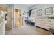A light blue bedroom featuring storage, artwork and a changing table at 4249 Millside Walk, Smyrna, GA 30080