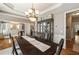 Elegant dining room showcasing a large table, chandelier, and views to other spaces at 4249 Millside Walk, Smyrna, GA 30080