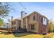 Exterior of two-story home with a brick and tan siding and a large chimney at 4249 Millside Walk, Smyrna, GA 30080