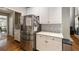 Bright kitchen with stainless steel refrigerator and white cabinets at 4249 Millside Walk, Smyrna, GA 30080
