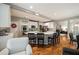 Bright, open-concept kitchen with a center island, stainless appliances, and a seamless flow into the dining area at 4249 Millside Walk, Smyrna, GA 30080