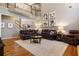 Spacious living room showcases hardwood floors and a large sectional, creating an inviting gathering space at 4249 Millside Walk, Smyrna, GA 30080