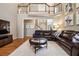 Comfortable living room with hardwood floors, a large sectional, and seamless flow into adjacent living spaces at 4249 Millside Walk, Smyrna, GA 30080