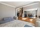 Open-concept living room showcasing hardwood floors, stairs, and views of the dining area at 4249 Millside Walk, Smyrna, GA 30080