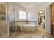 Bright bathroom with tub and glass shower at 4249 Millside Walk, Smyrna, GA 30080