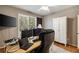Well-lit home office with two monitors, a desk, and a comfortable chair at 4249 Millside Walk, Smyrna, GA 30080